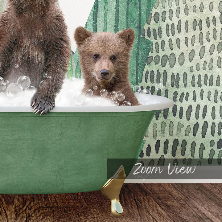 A young brown bear cub is sitting in a green bathtub filled with bubbles, while an adult brown bear is sitting on the edge of the tub.