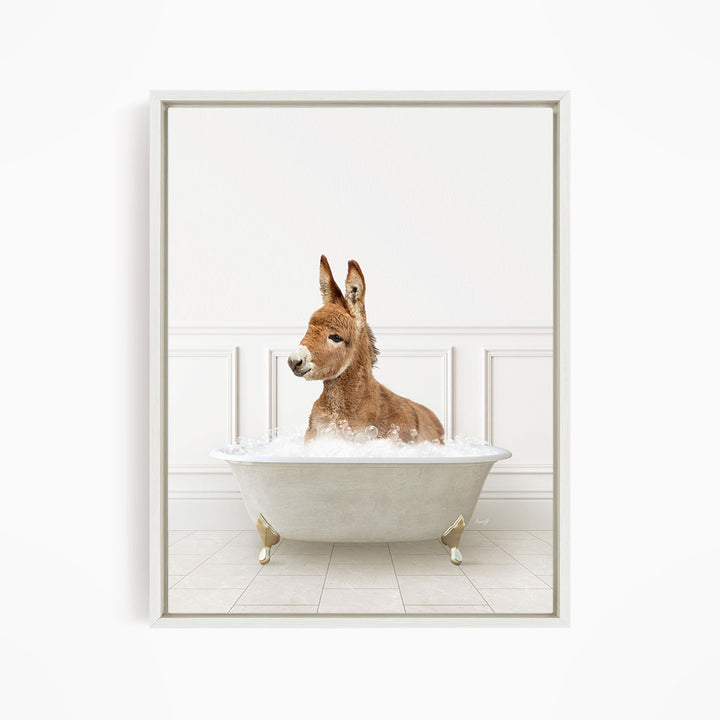 A donkey is sitting in a white bathtub filled with water, creating a whimsical and playful scene.