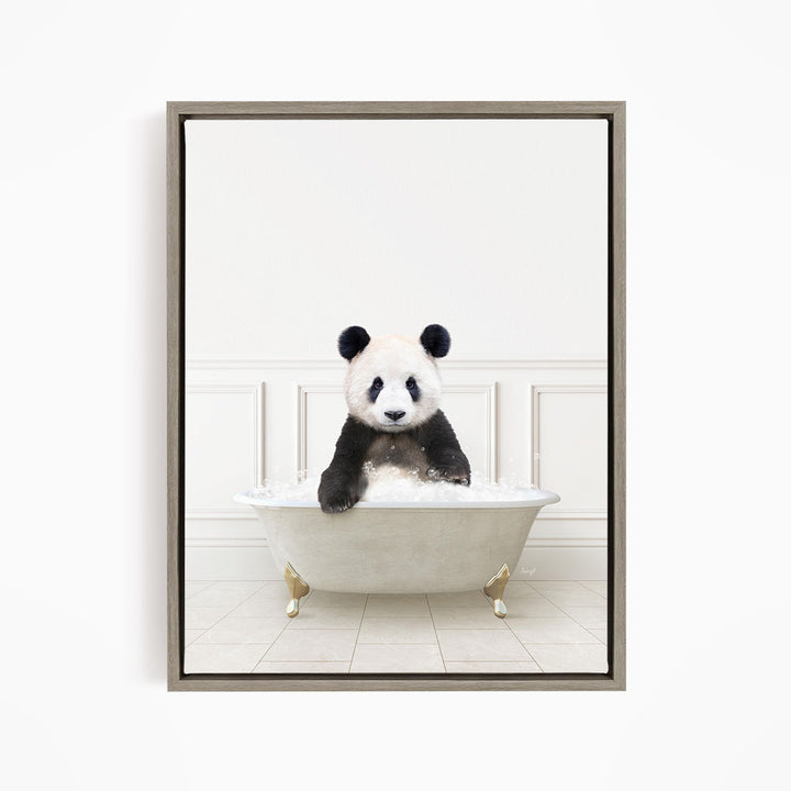 A panda bear sitting in a white bathtub filled with bubbles, looking directly at the camera.