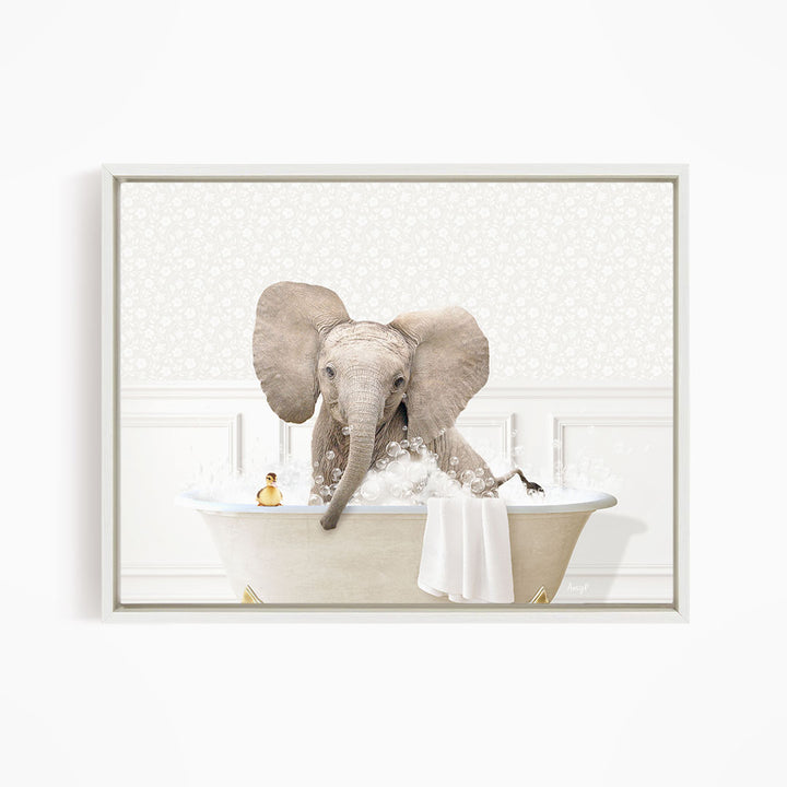 A baby elephant sitting in a bathtub filled with water, surrounded by bubbles and a towel.