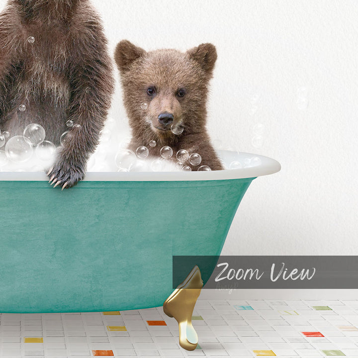 A young bear cub sitting in a green bathtub filled with bubbles, with a text overlay that reads "Zoom View".