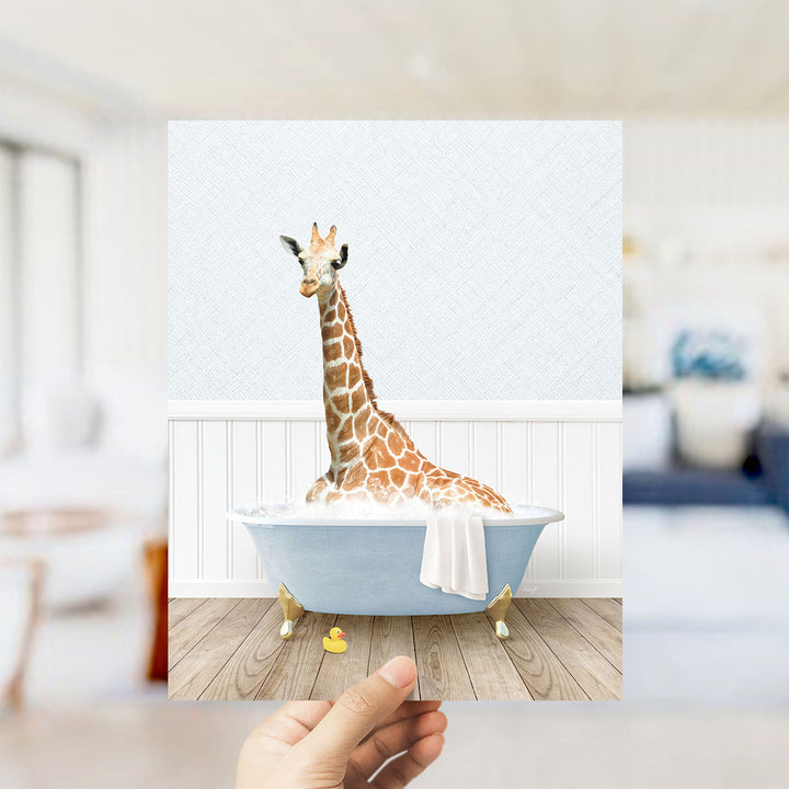 A giraffe sitting in a bathtub filled with water, surrounded by a white wall and wooden floor.