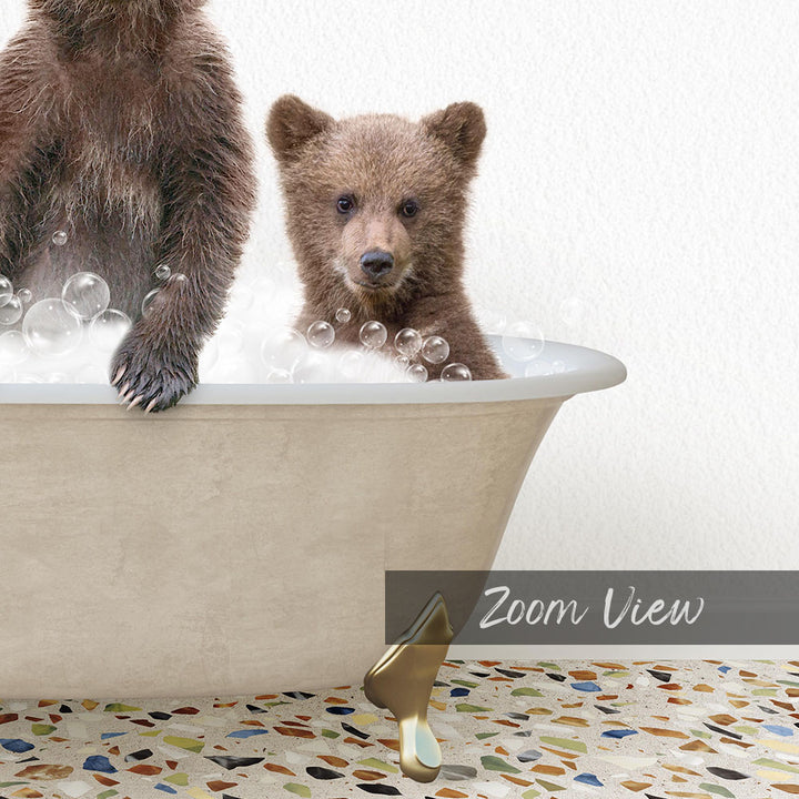 A baby bear sitting in a bathtub filled with bubbles, with a text overlay that reads "Zoom View".