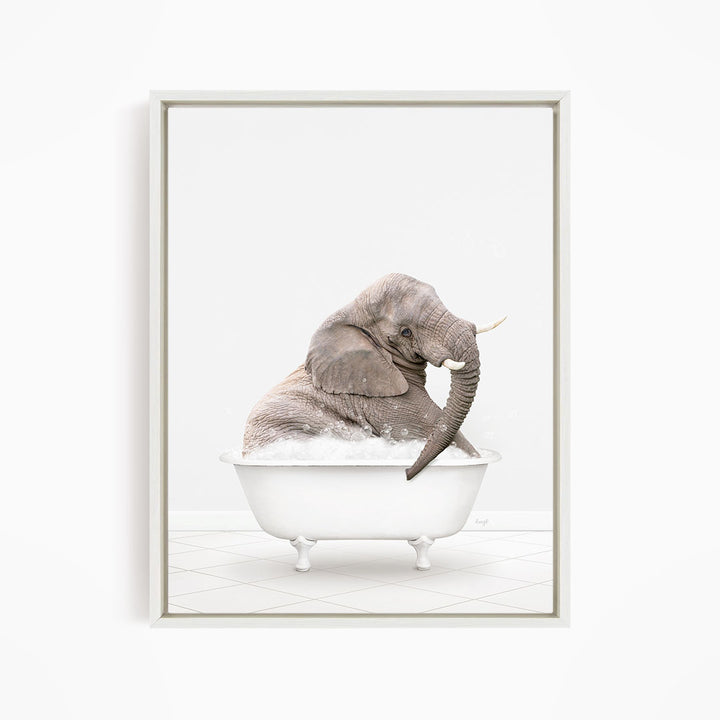 A gray elephant is sitting in a white bathtub filled with water, creating a whimsical and playful scene.