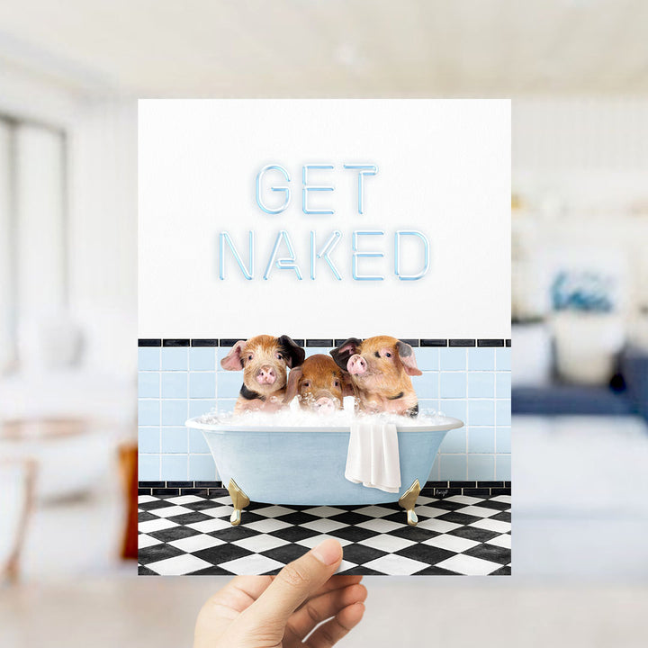 A hand holding a card with a photo of three pigs sitting in a bathtub, with the text "GET NAKED" displayed above the image.