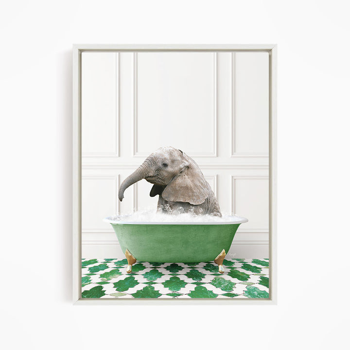 A baby elephant sitting in a green bathtub filled with water, surrounded by a green and white patterned floor.