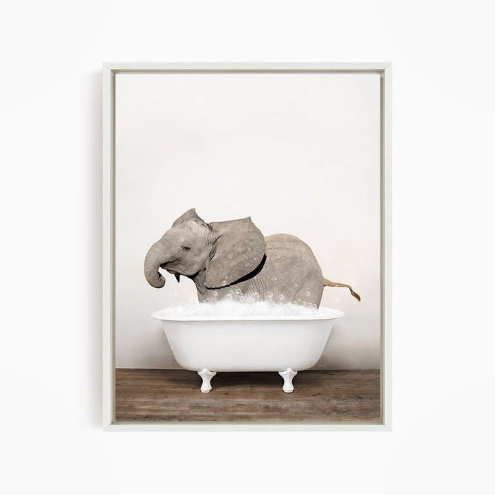 A gray elephant is standing in a white bathtub filled with water, creating a whimsical and playful scene.