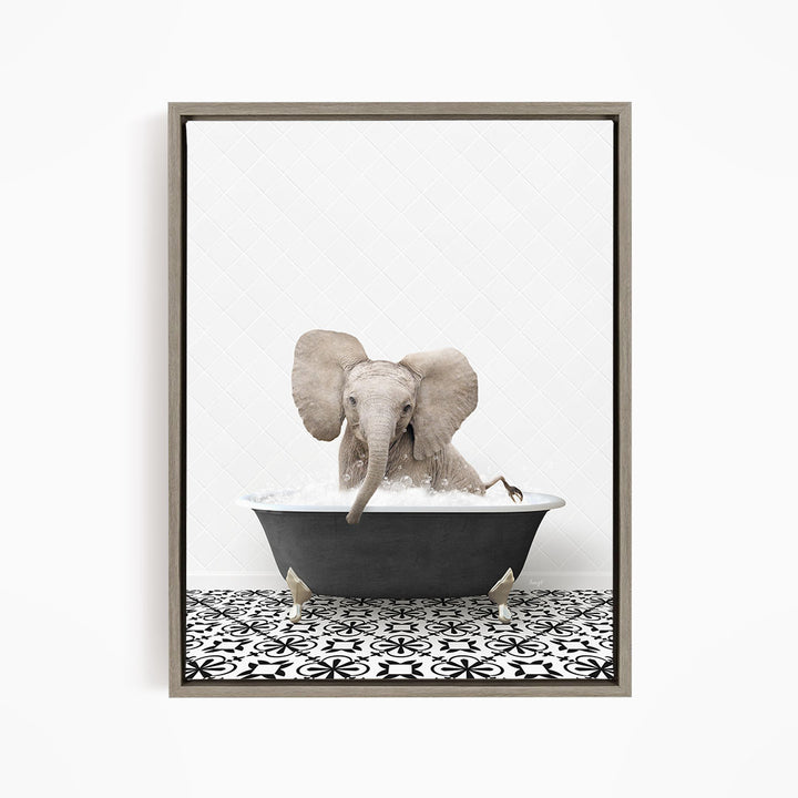 A gray elephant is sitting in a black bathtub filled with water, creating a whimsical and playful scene.