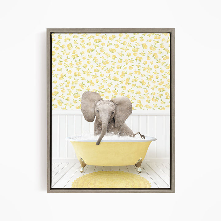 A gray elephant sitting in a yellow bathtub filled with water, surrounded by a yellow floral pattern on the wall behind it.