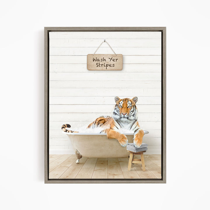A tiger is sitting in a bathtub, with a sign above it that says "Wash Yer Stripes".