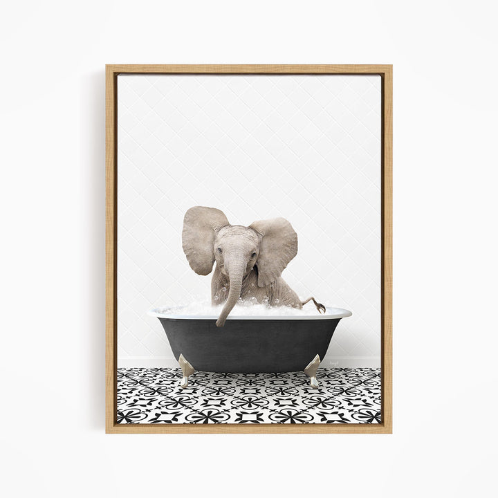A gray elephant is sitting in a black bathtub filled with water, creating a whimsical and playful scene.