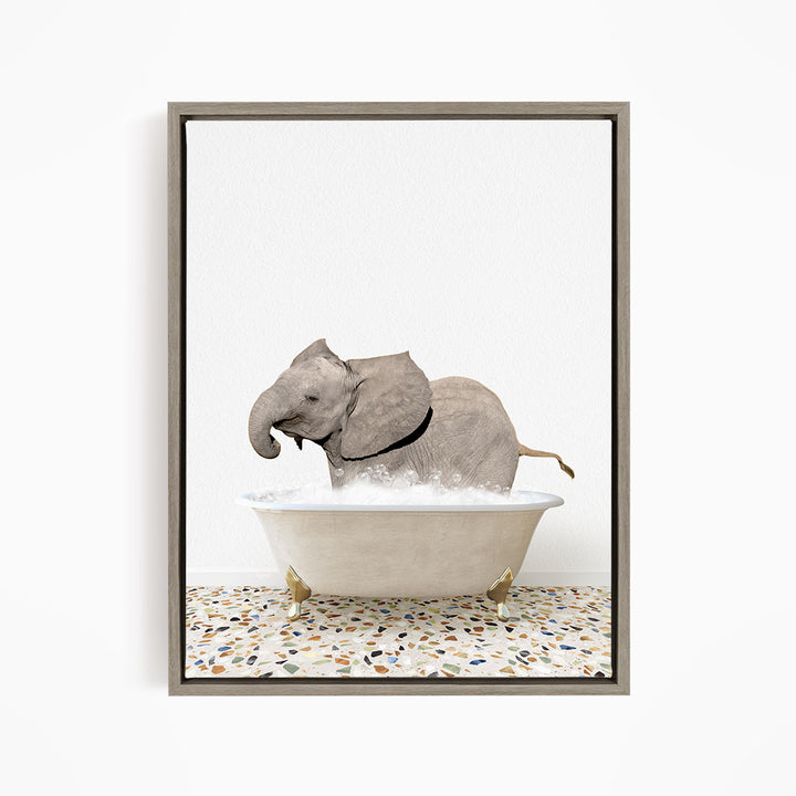 A gray elephant is sitting in a white bathtub filled with water, creating a whimsical and playful scene.