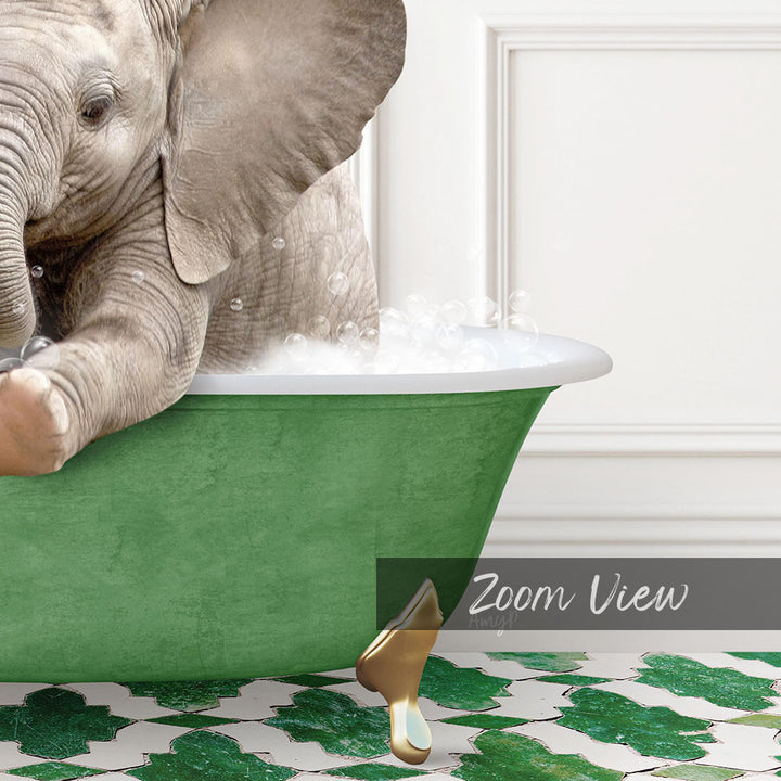A baby elephant sitting in a green bathtub filled with water, surrounded by a patterned green and white floor.
