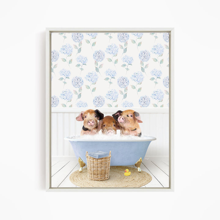 Three adorable pigs sitting in a blue bathtub, surrounded by a floral patterned wall and a yellow rubber duck.