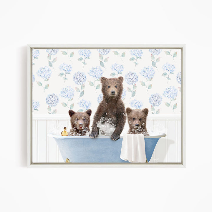 Three adorable brown bears enjoying a relaxing bath in a blue tub, surrounded by a floral patterned wall.