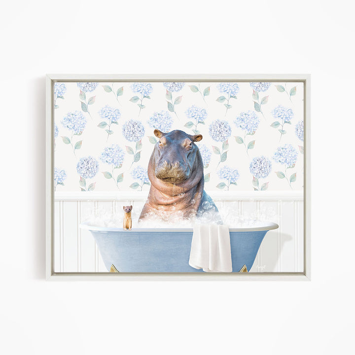 A large hippopotamus sitting in a blue bathtub, surrounded by a floral patterned wall and a small figurine.