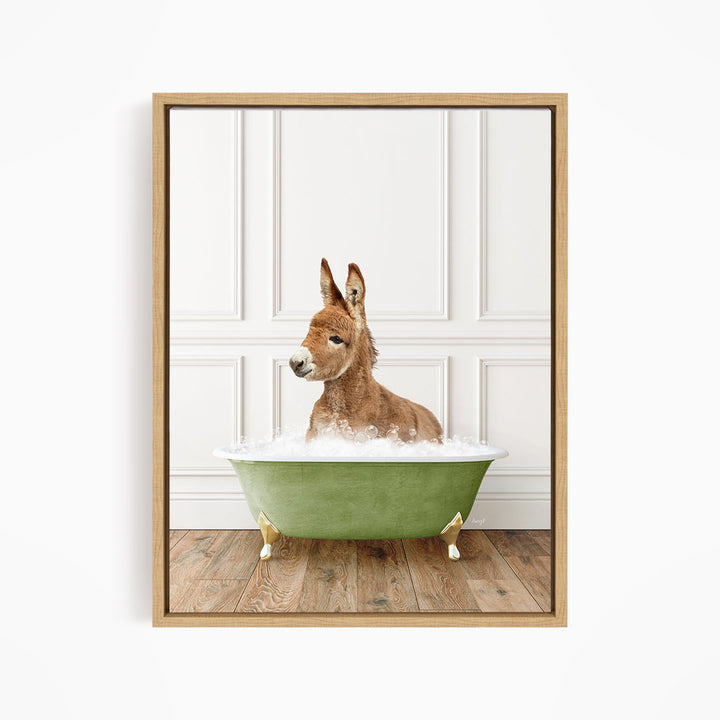 A donkey is sitting in a green bathtub filled with water, looking at the camera.