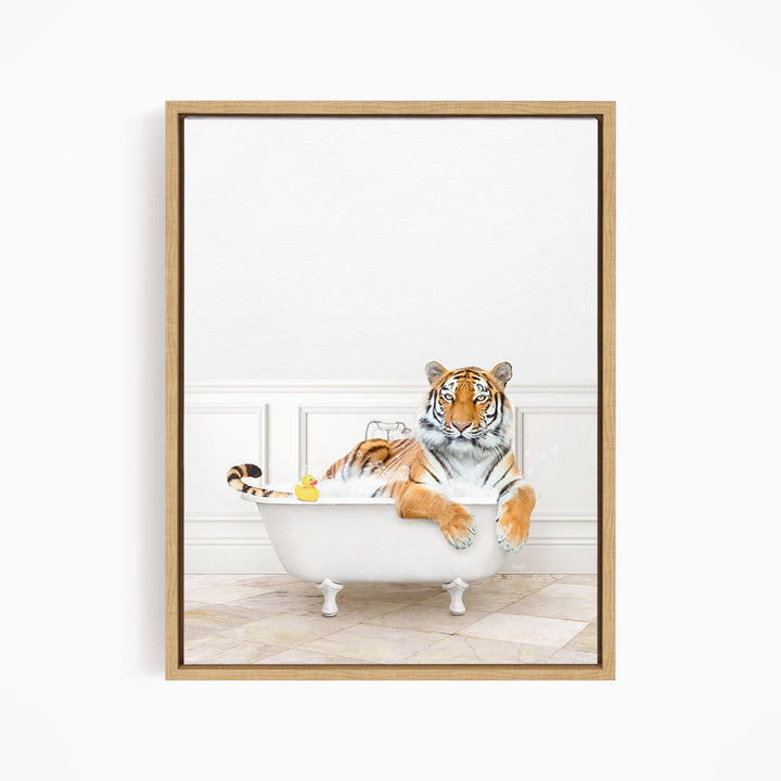 A tiger is sitting in a white bathtub, surrounded by a yellow rubber duck.