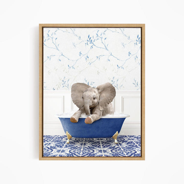 A baby elephant sitting in a blue bathtub, surrounded by a blue and white patterned floor and a floral wallpaper background.