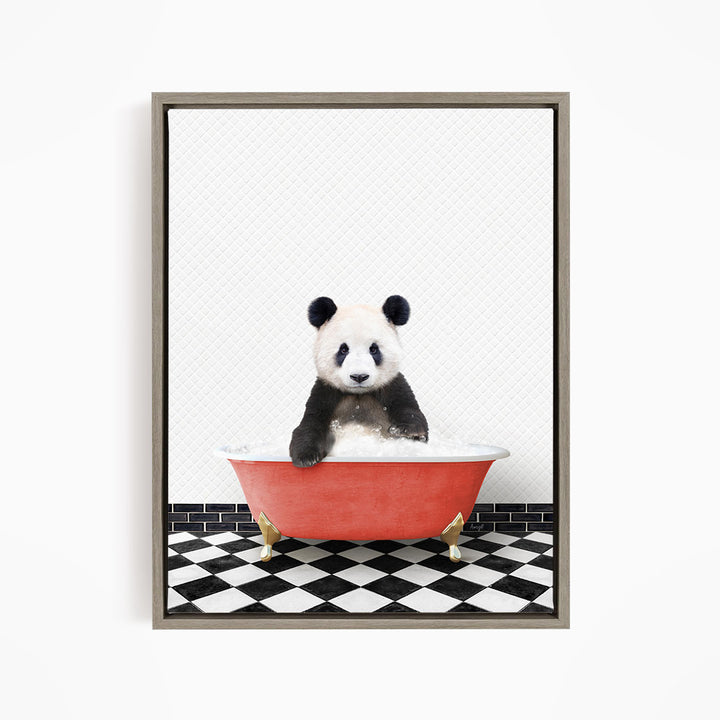 A panda bear sitting in a red bathtub on a black and white checkered floor.