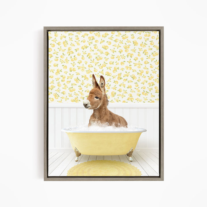 A donkey is sitting in a yellow bathtub filled with bubbles, surrounded by a yellow and white floral patterned wall.