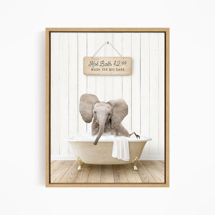 A framed image of an elephant sitting in a bathtub, with a sign above it that reads "Hot Bath $2.00 WASH YER BIG BARS".