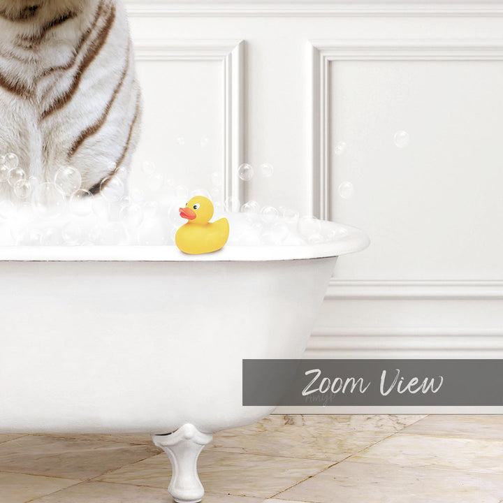 A white bathtub filled with bubbles, with a yellow rubber duck sitting on the edge.