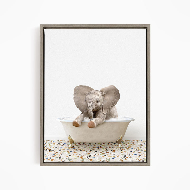 A baby elephant sitting in a bathtub filled with water, surrounded by a speckled floor.