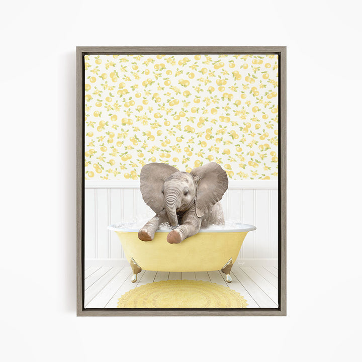 A baby elephant sitting in a yellow bathtub, surrounded by a yellow and white floral pattern on the wall behind it.