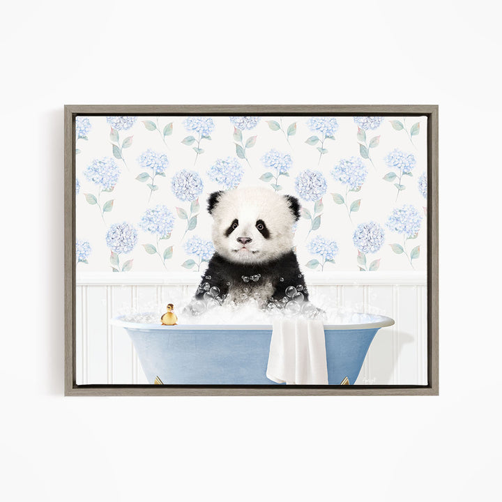 A panda bear sitting in a blue bathtub filled with bubbles, surrounded by a floral patterned wall.