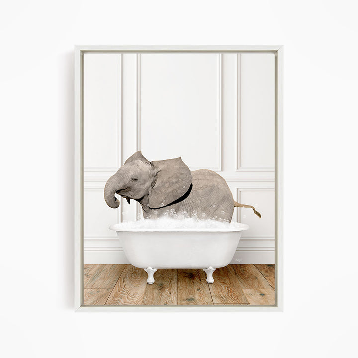 A gray elephant is sitting in a white bathtub filled with water, creating a whimsical and playful scene.