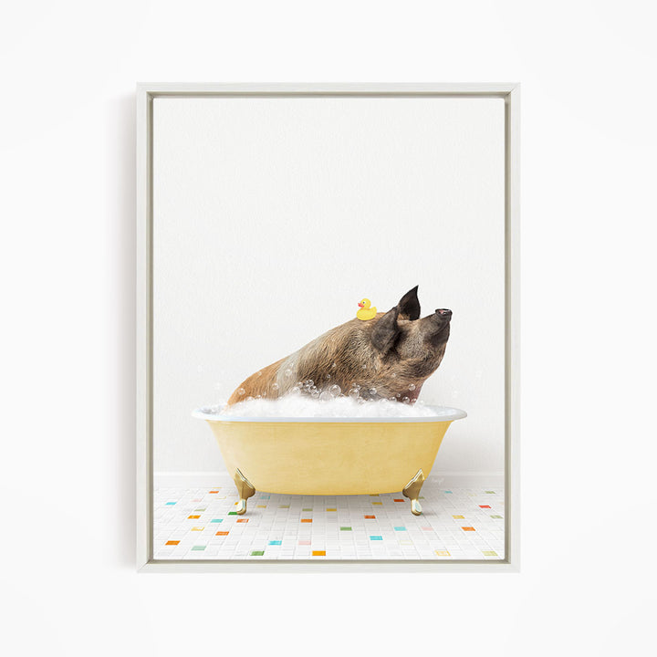 A brown dog is sitting in a yellow bathtub filled with bubbles, with a rubber duck floating on the water.