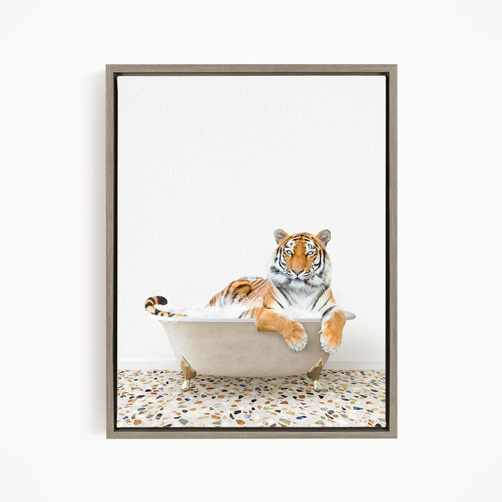 A tiger is sitting in a bathtub, appearing relaxed and comfortable.