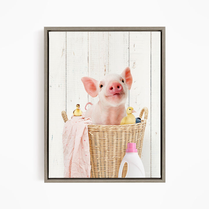 A cute pig sitting in a wicker basket filled with rubber ducks, surrounded by various household items such as a bottle of detergent.
