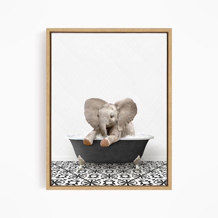 A baby elephant sitting in a bathtub filled with water, surrounded by a black and white patterned floor.