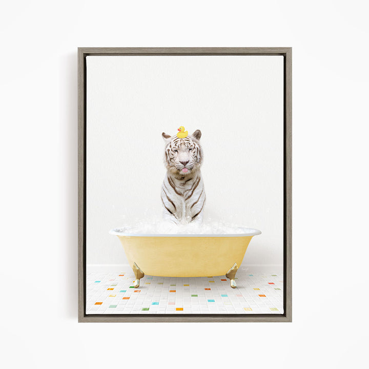 A white tiger is sitting in a yellow bathtub filled with bubbles, with a yellow rubber duck perched on its head.