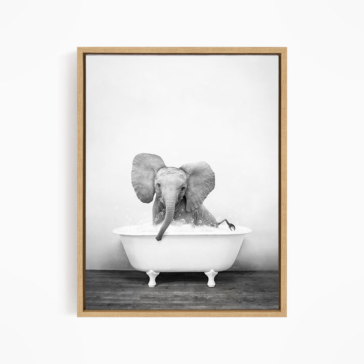 A baby elephant sitting in a bathtub filled with water, creating a playful and whimsical scene.