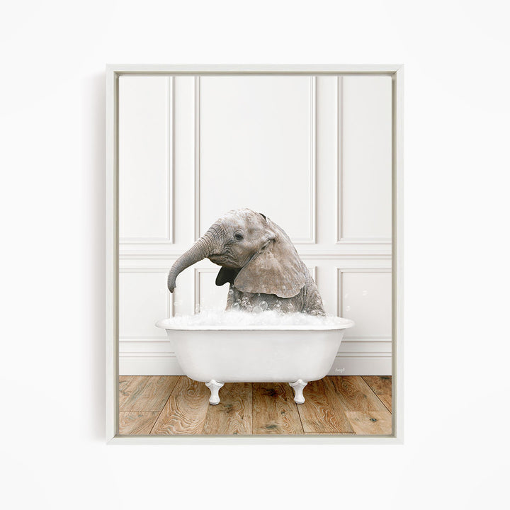 A baby elephant sitting in a white bathtub filled with water, creating a playful and whimsical scene.