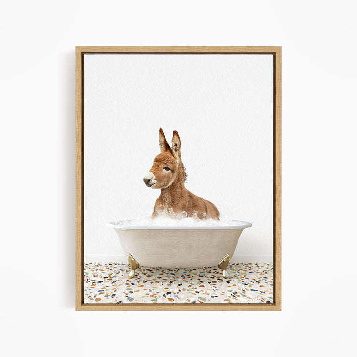 A donkey is sitting in a white bathtub filled with water, creating a playful and whimsical scene.