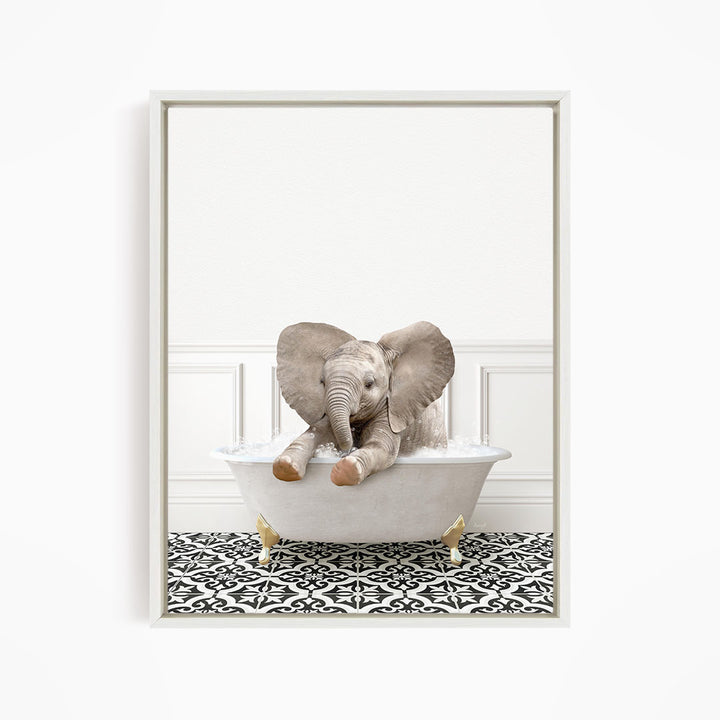 A baby elephant sitting in a white bathtub filled with water, surrounded by a black and white patterned floor.