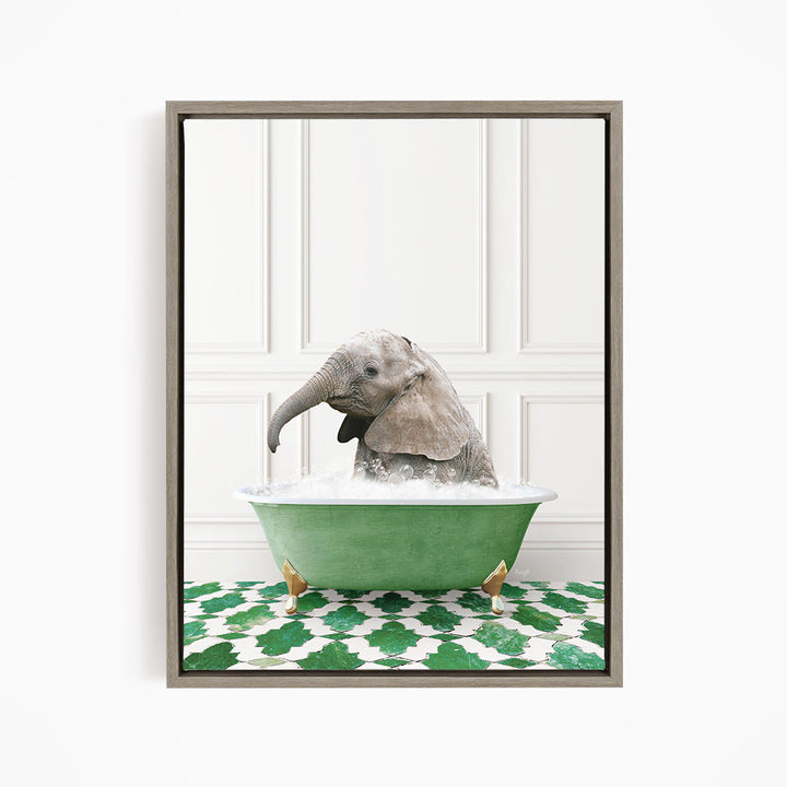 A gray elephant is sitting in a green bathtub filled with water, surrounded by a green and white patterned floor.