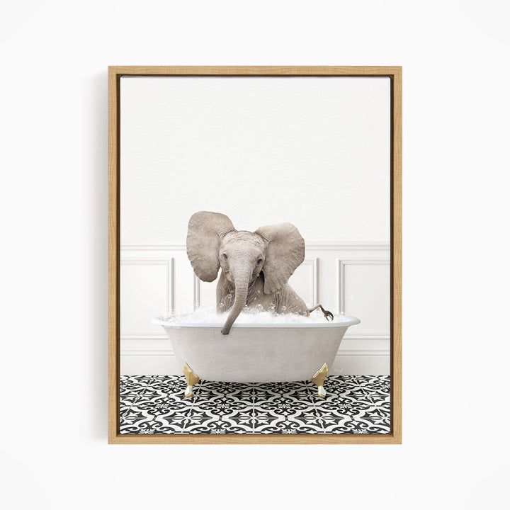 A gray elephant is sitting in a white bathtub filled with water, creating a whimsical and playful scene.