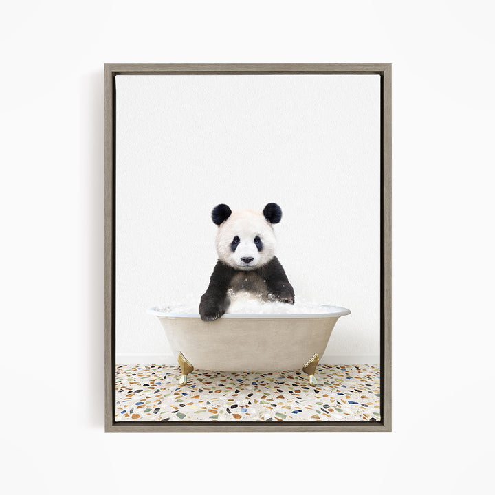 A panda bear sitting in a white bathtub filled with water, surrounded by a speckled floor.