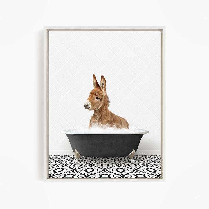 A donkey is sitting in a bathtub filled with water, surrounded by a black and white patterned floor.