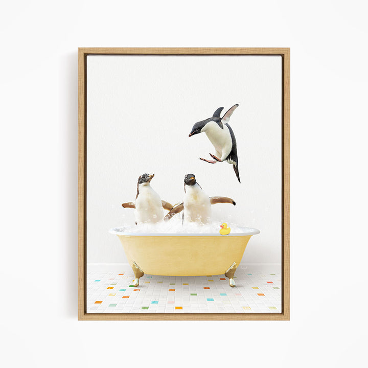A framed image depicting two penguins sitting in a yellow bathtub, with one penguin flying towards the other.