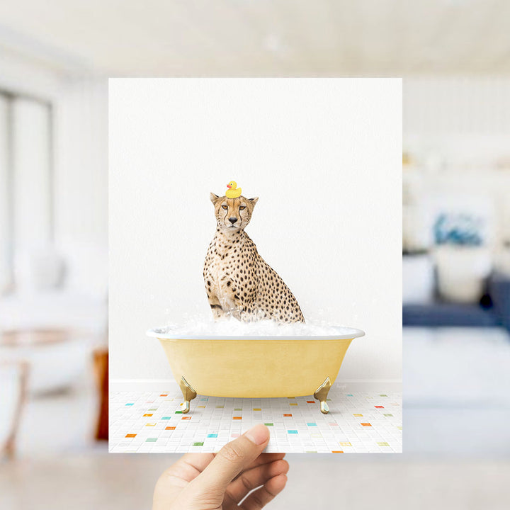 A cheetah sitting in a yellow bathtub filled with bubbles, wearing a yellow rubber duck hat.