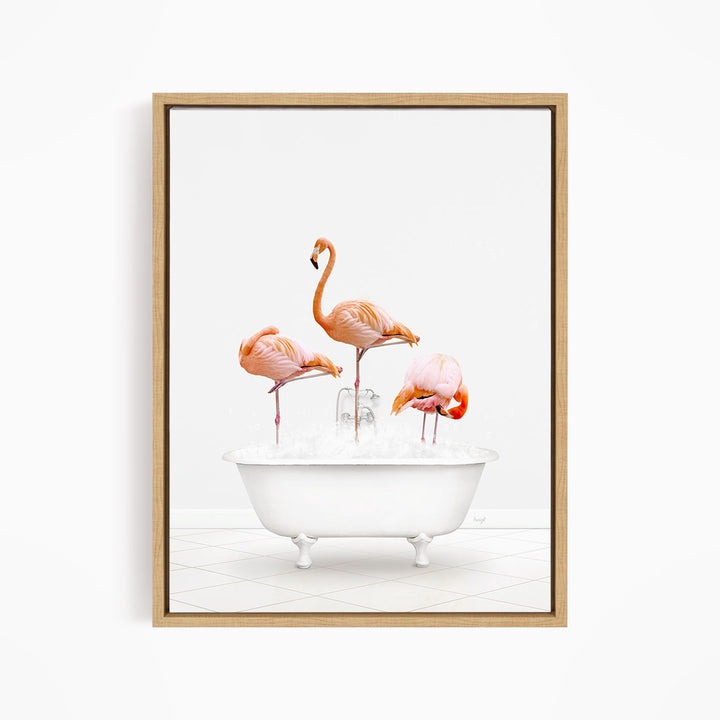 A framed image depicting three flamingos standing in a white bathtub filled with water.