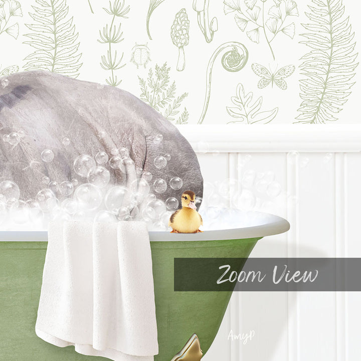 A baby duck sitting in a green bathtub filled with bubbles, with a towel draped over the side and a plant-themed wallpaper in the background.