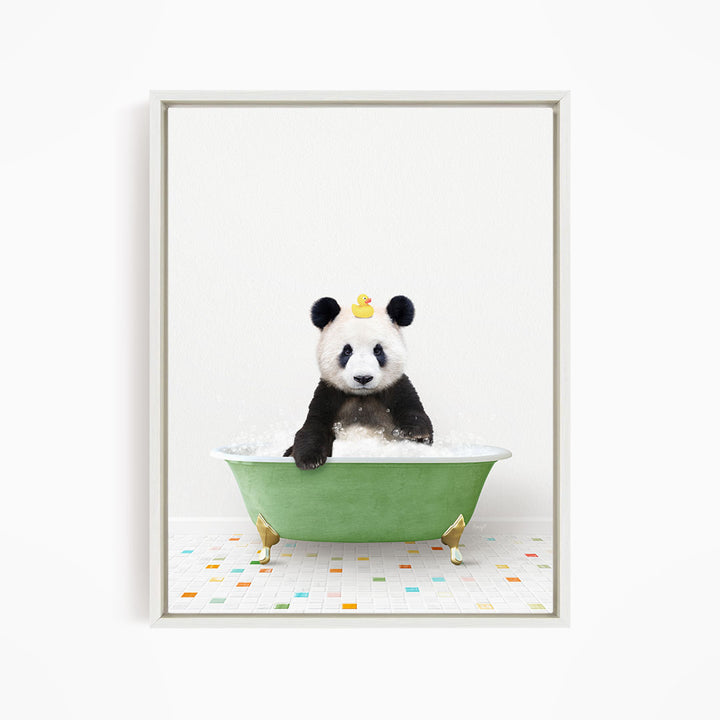 A panda bear sitting in a green bathtub, with a yellow rubber duck on its head.