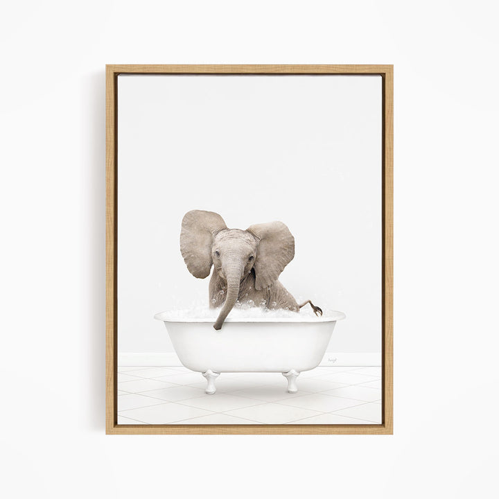 A baby elephant sitting in a white bathtub filled with water, with its trunk submerged in the water.